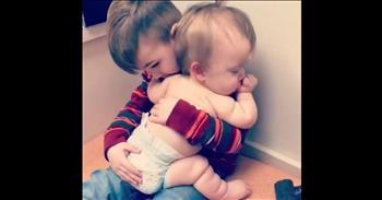 Big Brother Comforts Sick Baby Sister