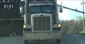 Truck Driver Escapes Being Crushed By Train Just In Time