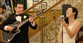 Bride And Groom Sing Acoustic Rendition Of ‘At Last’ For Guests