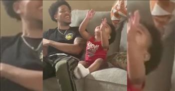 Adorable 2-Year-Old And Dad Worship Together On Couch