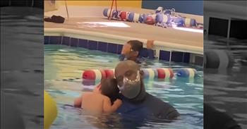 Baby And Swim Instructor Share Sweet Moment During Lesson