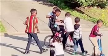 Neighborhood Kids Help Little Boy Learn To Ride A Bike